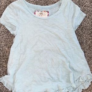 Blue shirt with ruffles on the bottom